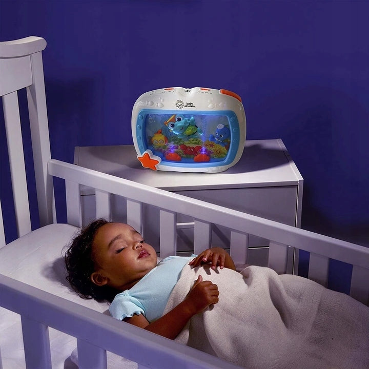 BABY EINSTEIN Vise marine CUTIUȚĂ MUZICALĂ + TELECOMANDĂ
