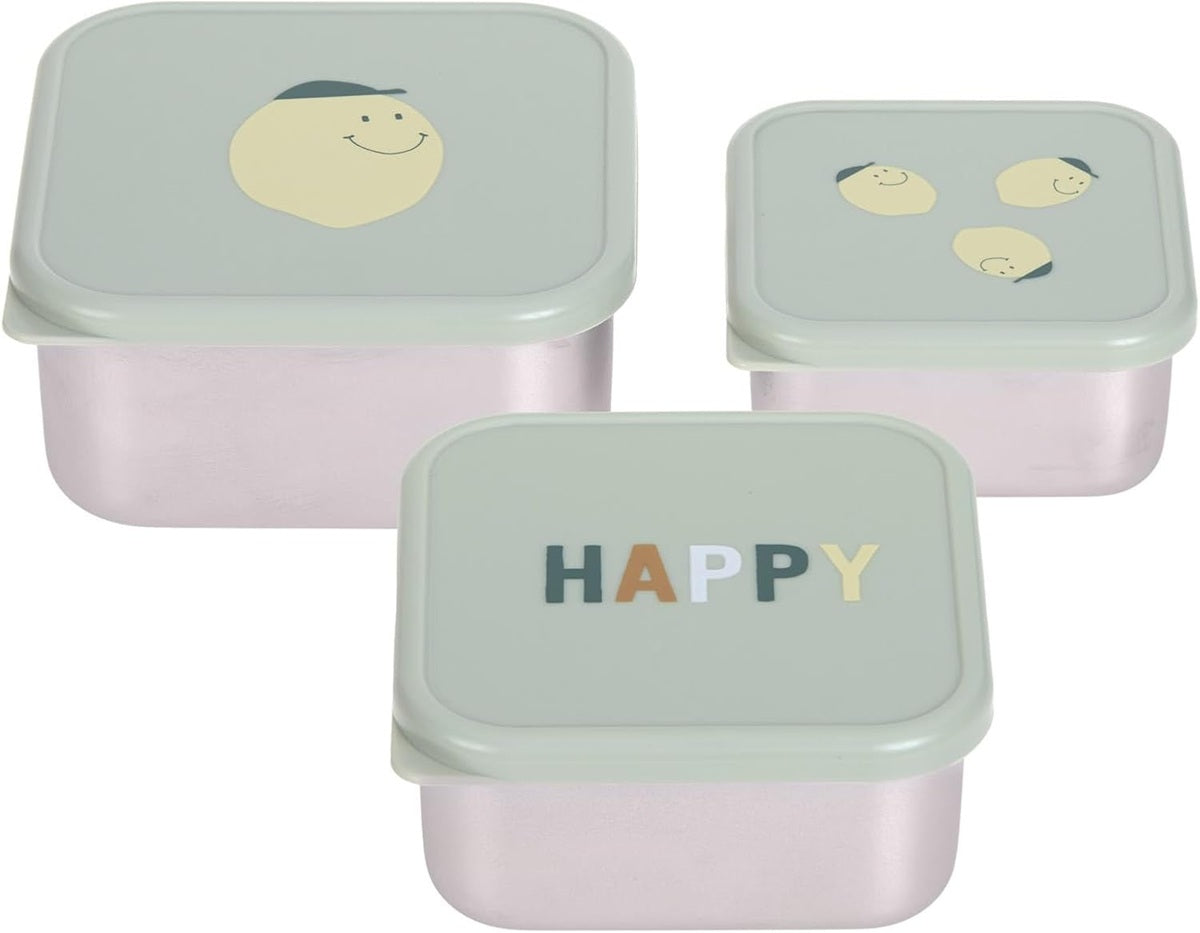 Trzy pojemniki z jasnymi pokrywkami; na pokrywkach widoczne buźki i napis HAPPY.