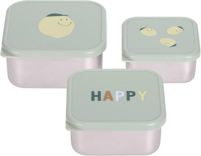 Trzy pojemniki z jasnymi pokrywkami; na pokrywkach widoczne buźki i napis HAPPY.