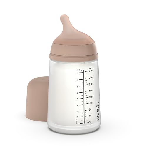 Butelka Suavinex Zero Zero Medium 270 ml z odsłoniętym smoczkiem i cielistą osłoną obok.
