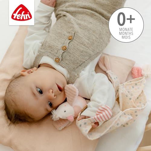 Fehn Bird – dziecko leżące z przytulanką